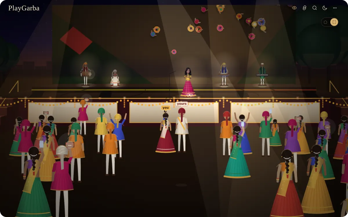 The stage with singers and band under moving lights, the crowd in front.